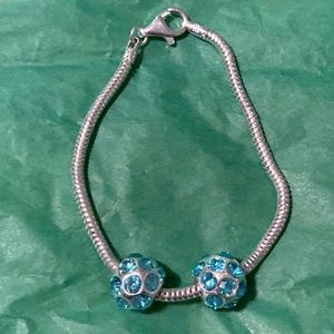 Genuine sterling silver bracelet from Italy with 2 light blue stone charms
